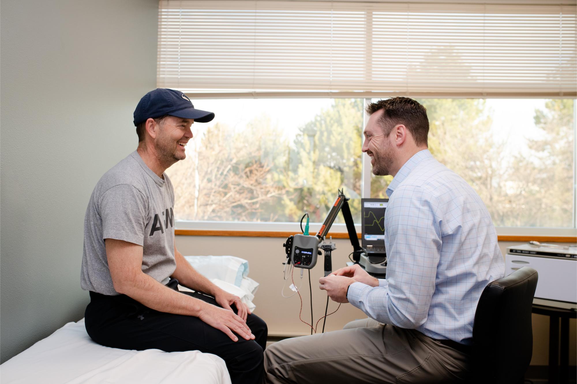 Man meeting with a physiatrist in a medical office